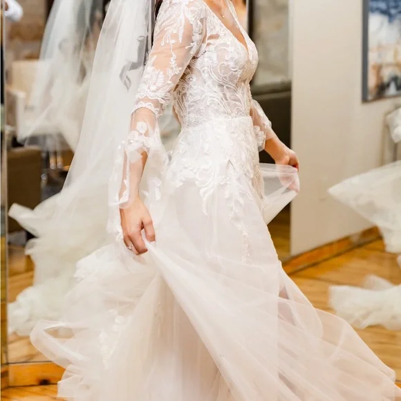 Maggie Sottero Ivory Lace Wedding Dress with Flowing Bell Sleeves and Slit